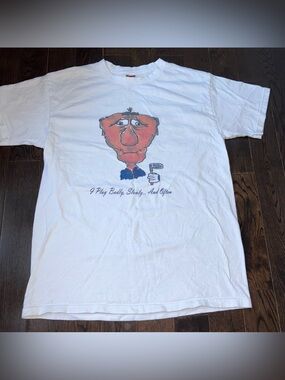 Funny Golf Tee “I play badly, slowly… and often”
